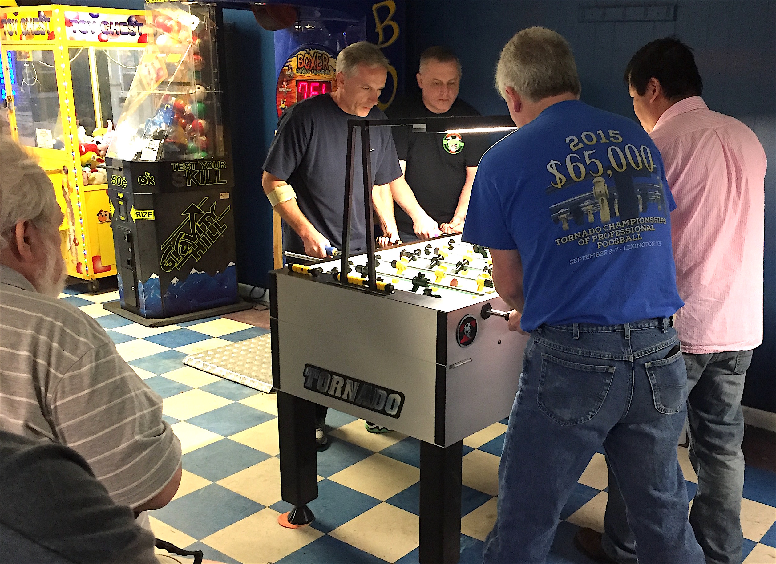 Foosball players competing in Cullman at the North Alabama Open foosball tournament.