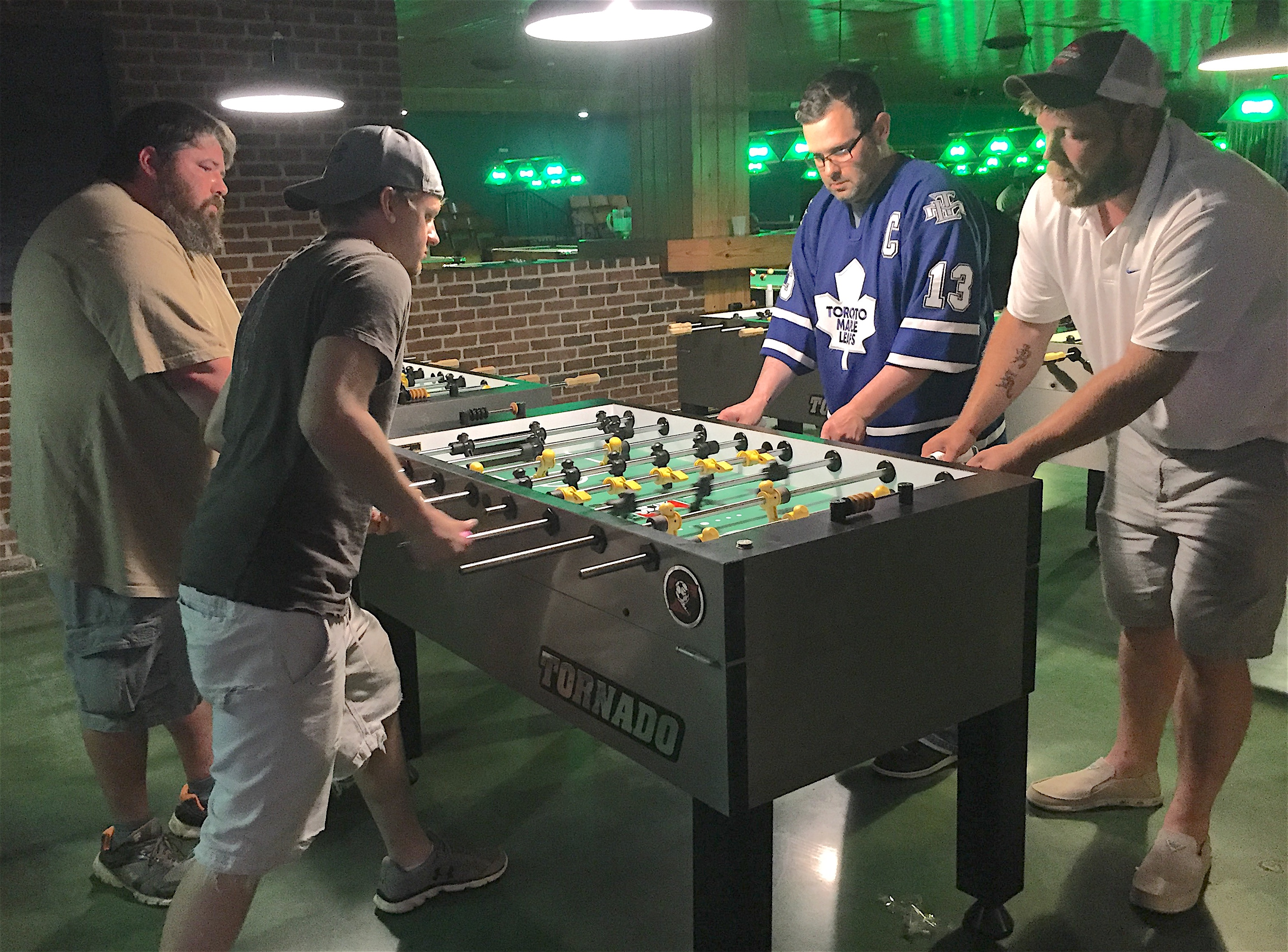 Foosball players Al Widok & Stephen Darby are shown playing against Randy Raposo & Nick Peterson at the Break Restaurant & Billiards located in the Five-points South area of Birmingham, Alabama. The business closes and the building is demolished later in the year 2018.