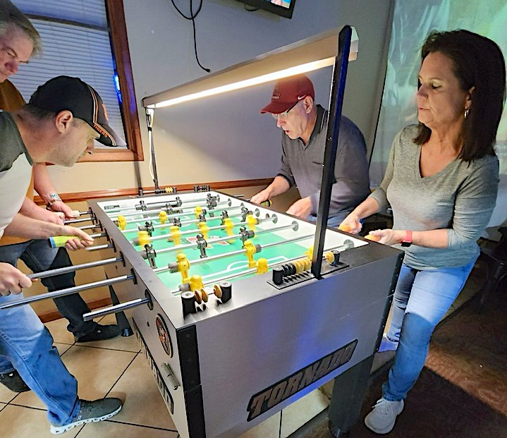 Players competing during Open Doubles competition of the 2025 North Alabama Open tournament held at 6 Pockets Bar & Billiards in Decatur,AL. where shown from left is John Smith, Jon Martin, Rodney Jenkins and Cheryl Lowe.